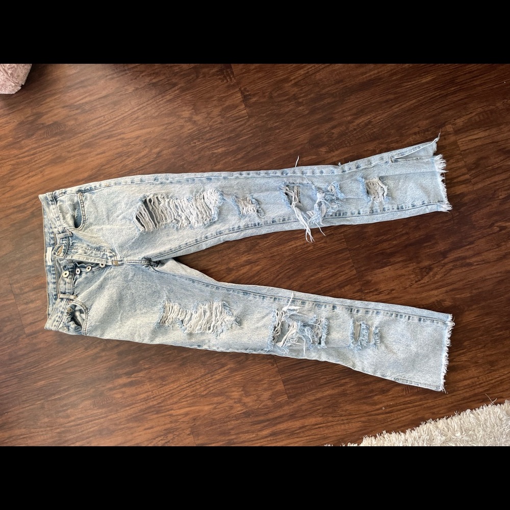 Trendy jeans with holes on both front and back.
